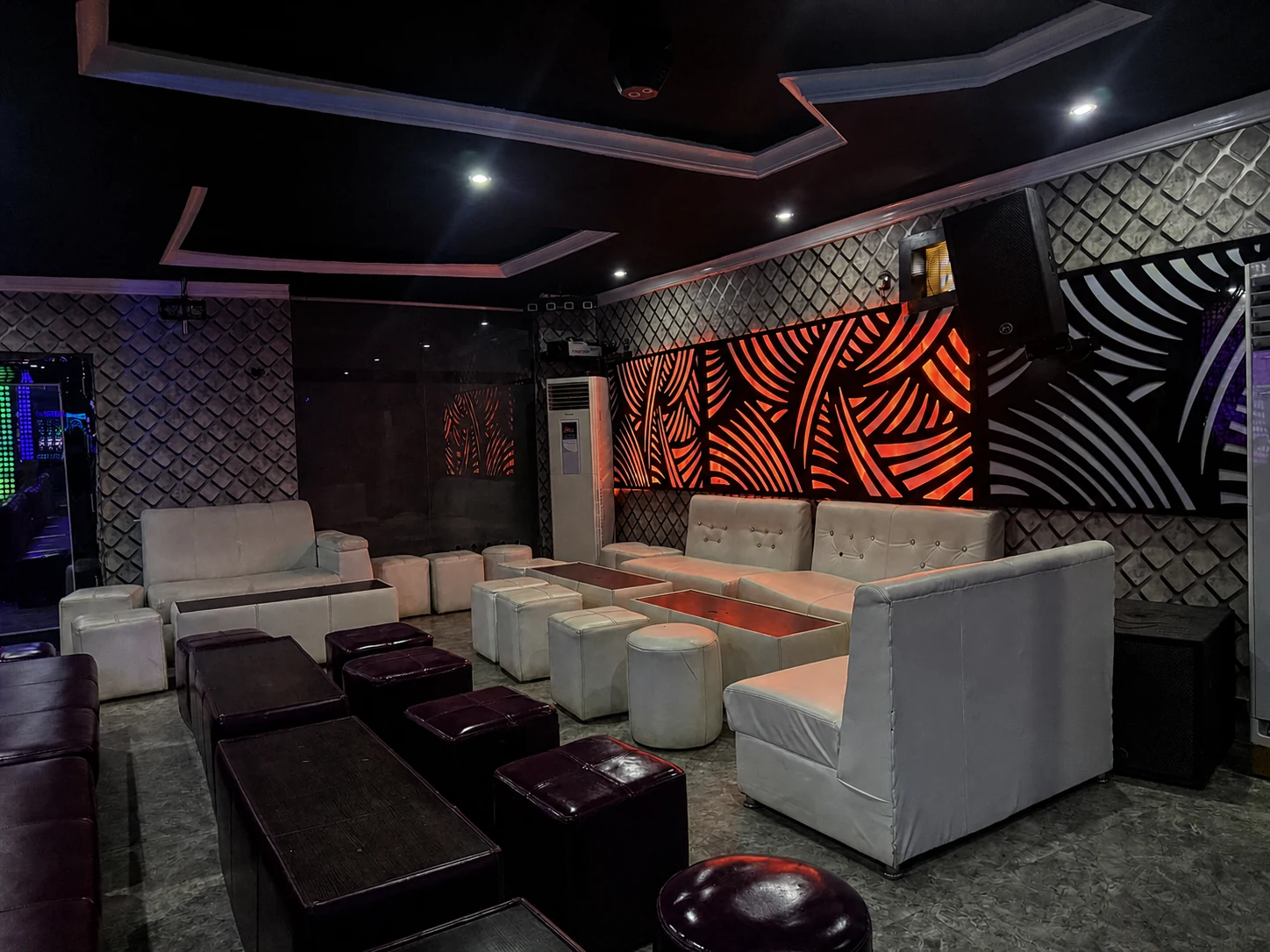 White seating area inside Arcadia's Nightclub