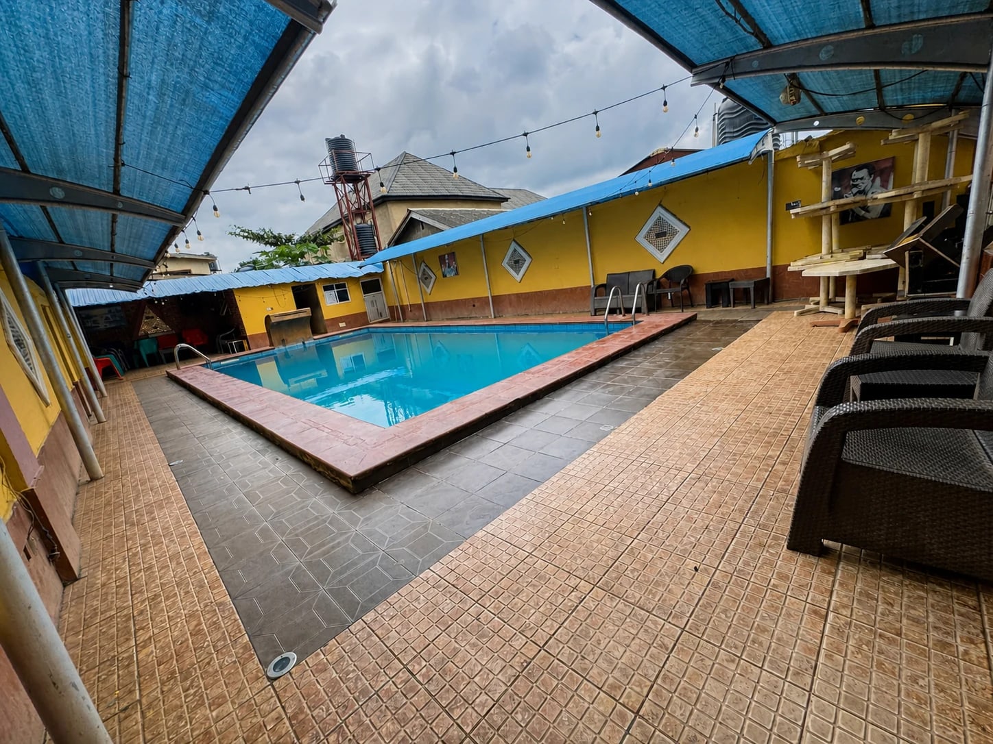 Wide view across the swimming pool at Arcadia Hotels & Suites